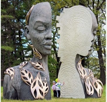 Morton Arboretum Statue with kids standing at base.