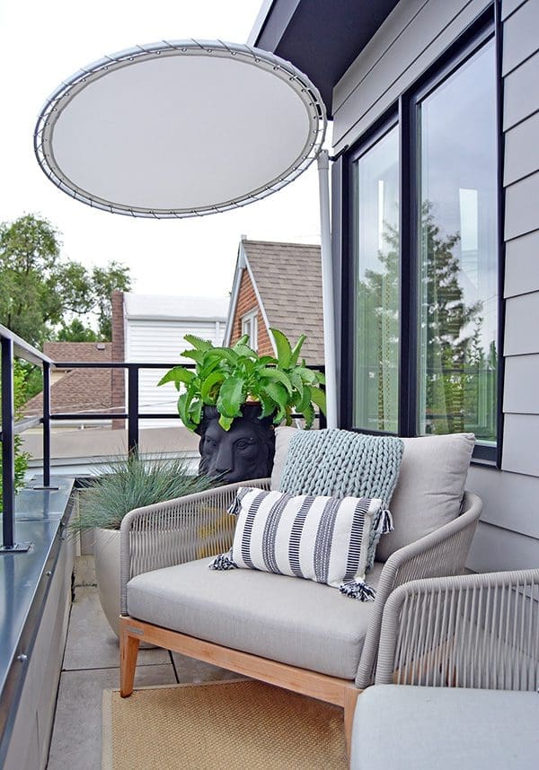 Shaded small outdoor seating area.