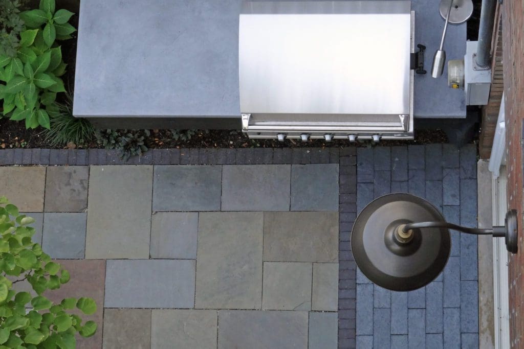 Overhead view of a bluestone paved patio area.