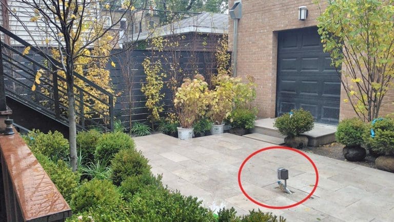 Outdoor patio area under construction with a gas line circled in red.