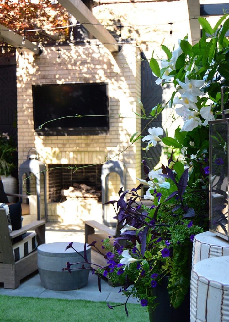 Outdoor fireplace with seating area.