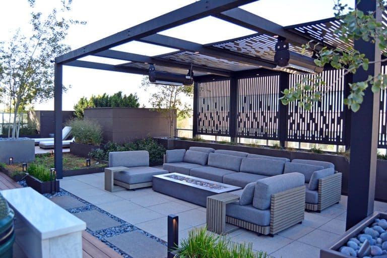 Outdoor patio area with rectangular gas fire pit feature.