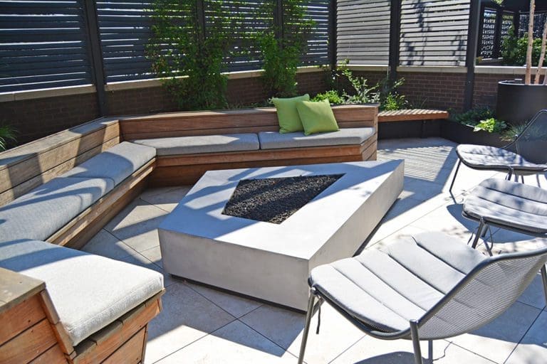 Custom shaped gas fire pit feature.
