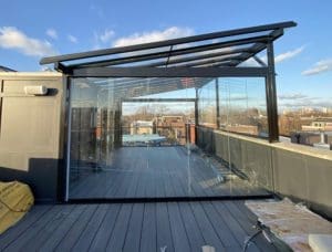 Glass enclosed outdoor roof deck.