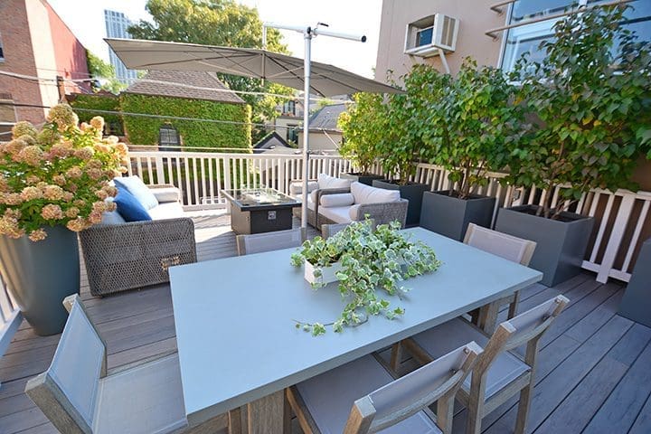Rooftop with dining, lounging, and grey containers